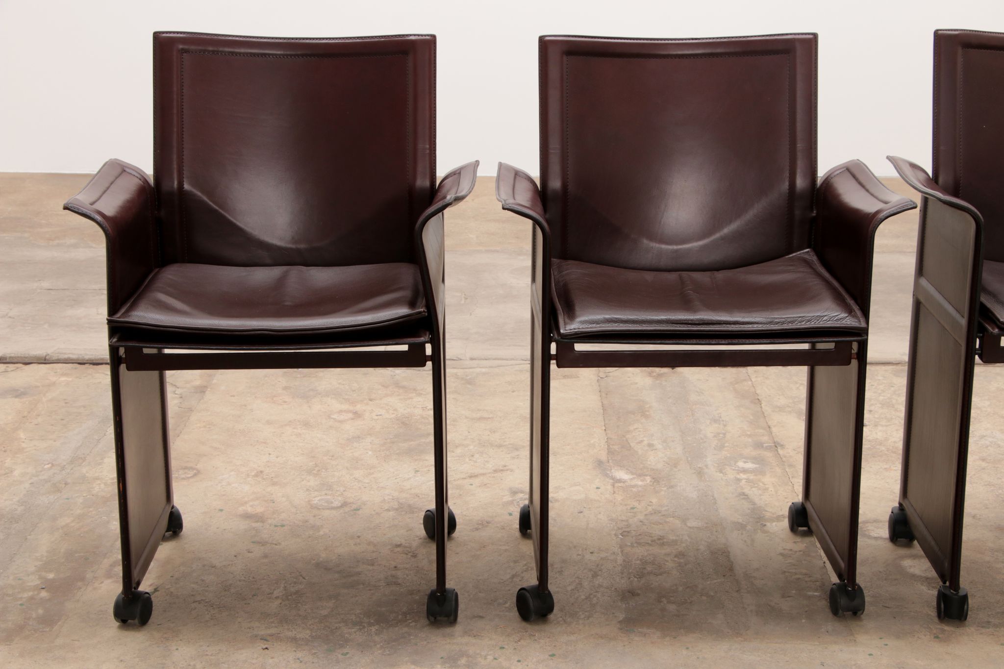 Tito Agnoli for Matteo Grassi leather dining table and six chairs