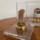 Vintage pair of bookends in lucite and brass from the 1970s.