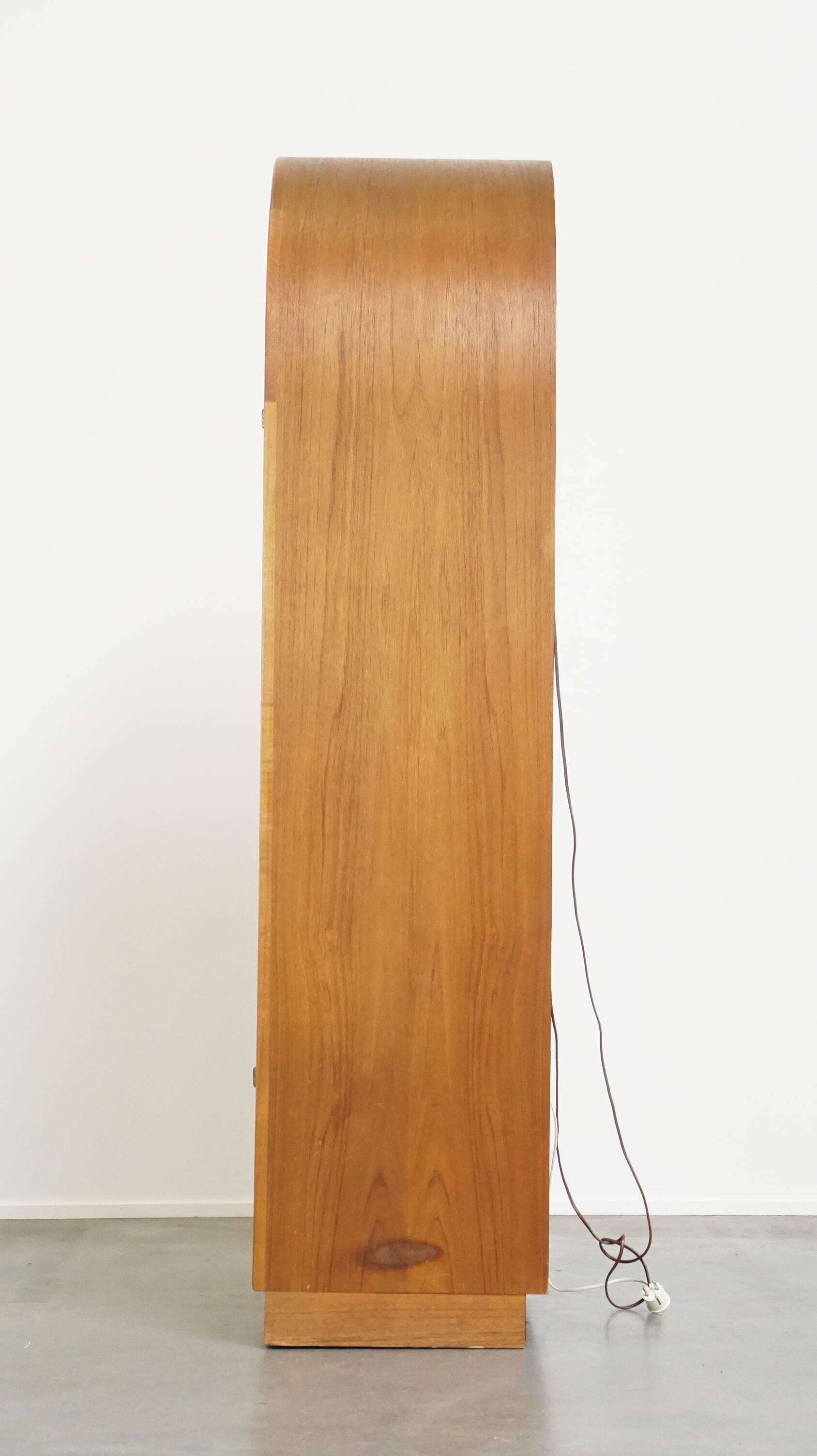 Elegant vintage Danish display cabinet with glass panels and atmospheric lighting