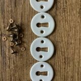 Set of 4 porcelain lock rosettes with gold screws – vintage