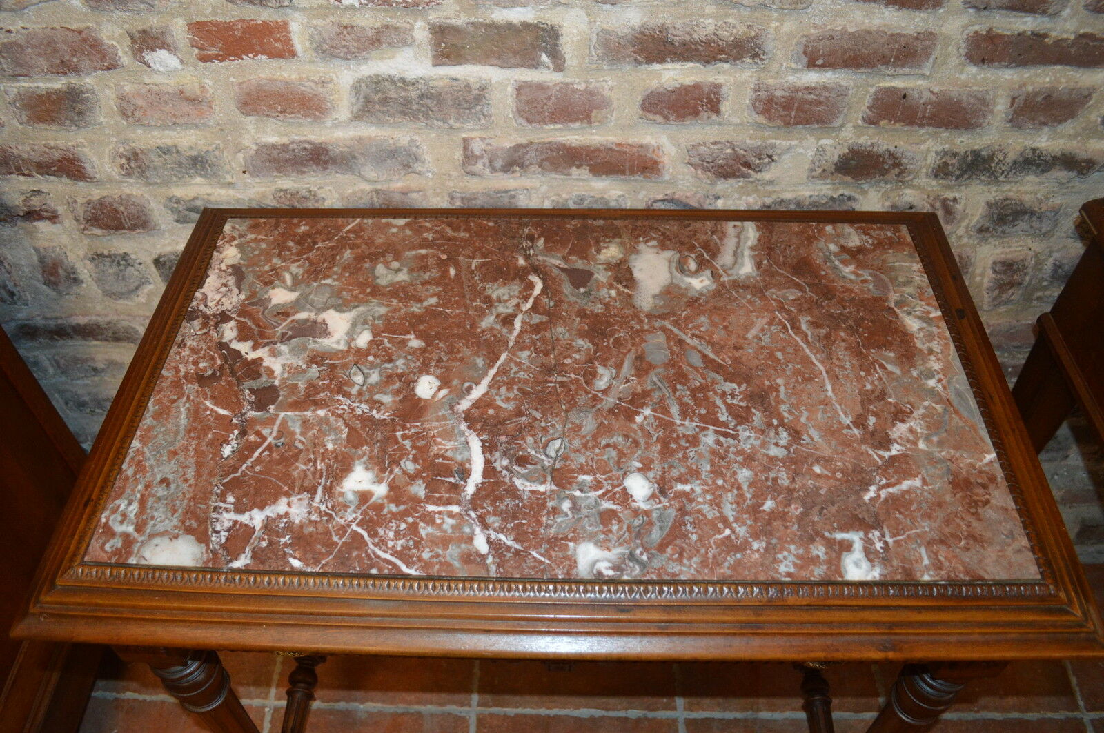 Walnut table with marble top and one drawer