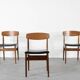 4 chaises en teck et similicuir, milieu XXème