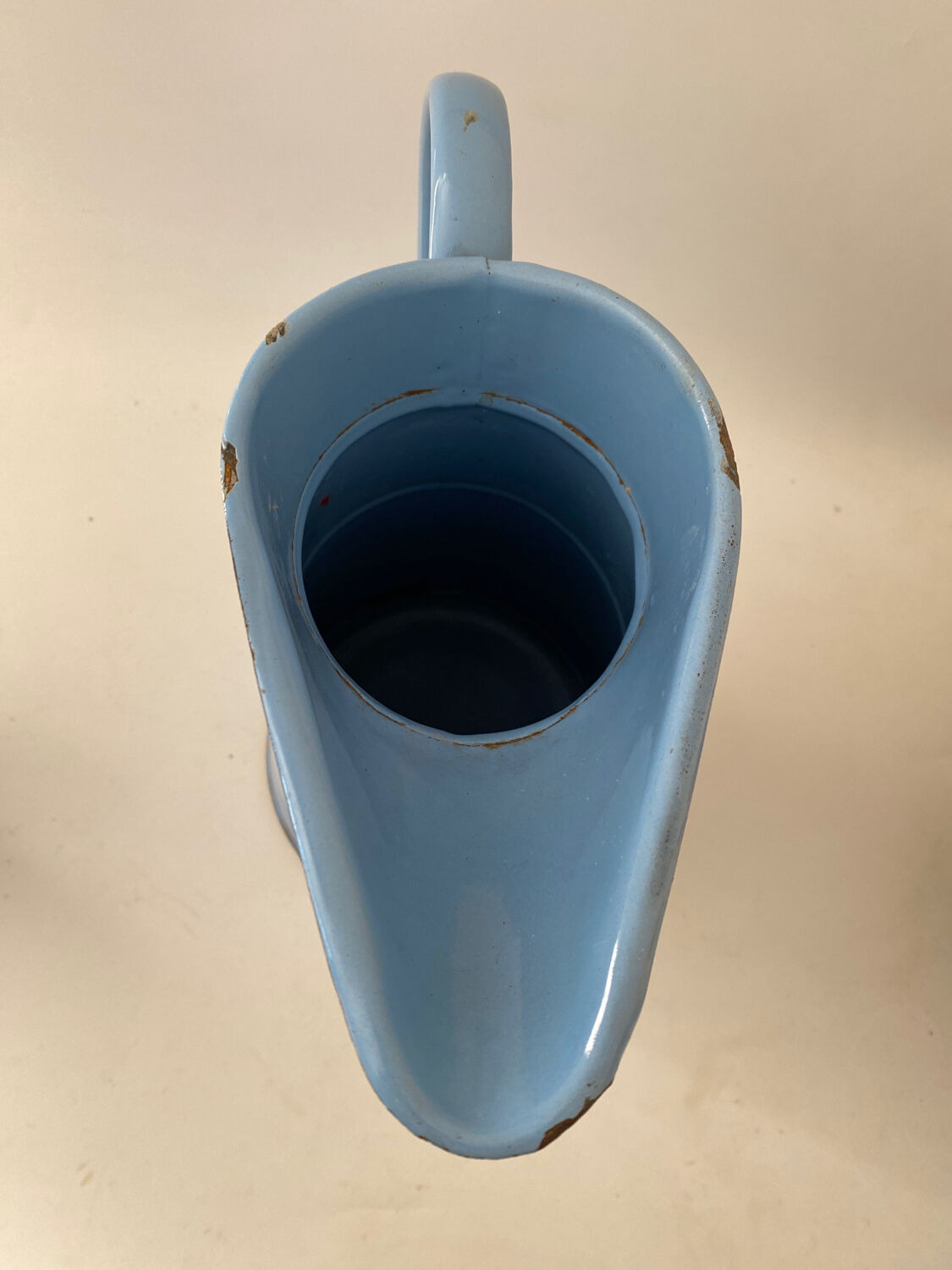Blue watering can
