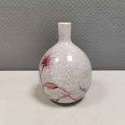 A vase in crackled porcelain with pink decoration. Germany 1930s