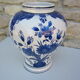Ceramic vase earthenware, blue floral decoration on a white background