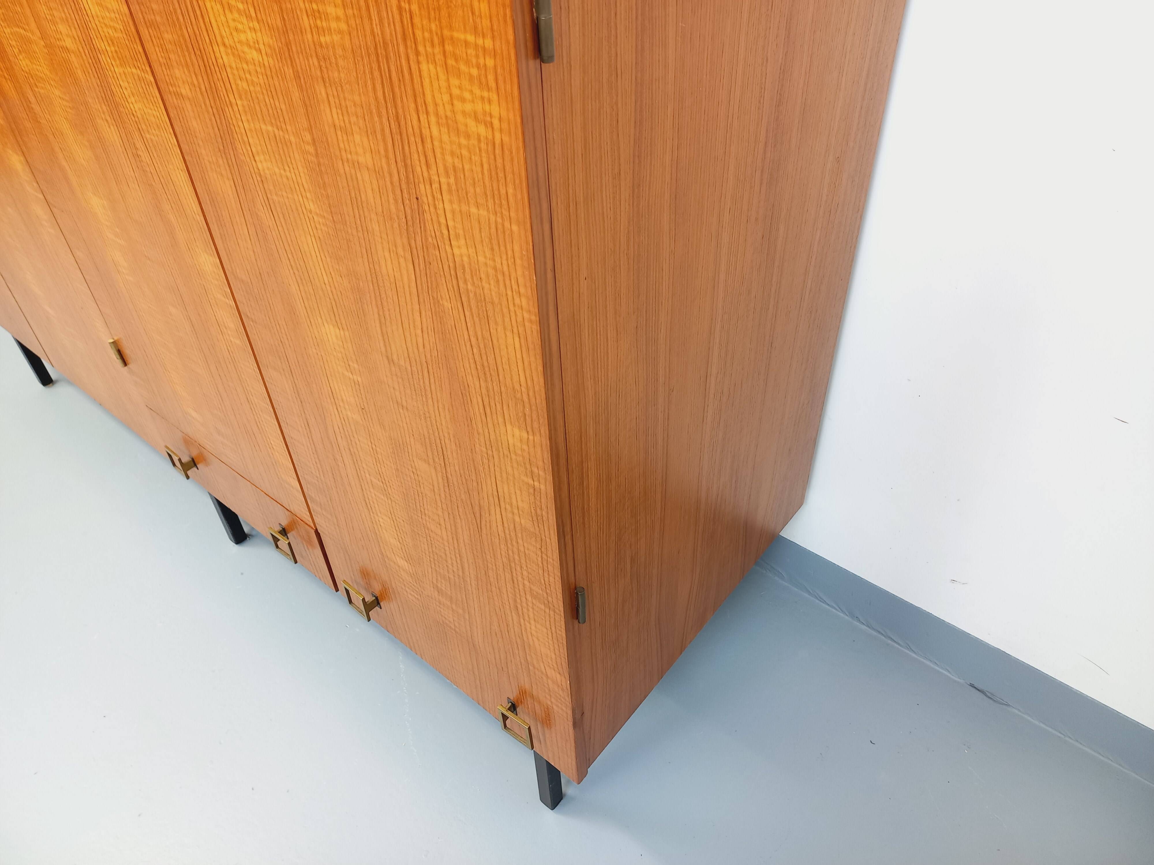 Vintage modernist wardrobe in teak and metal from the 1960s.