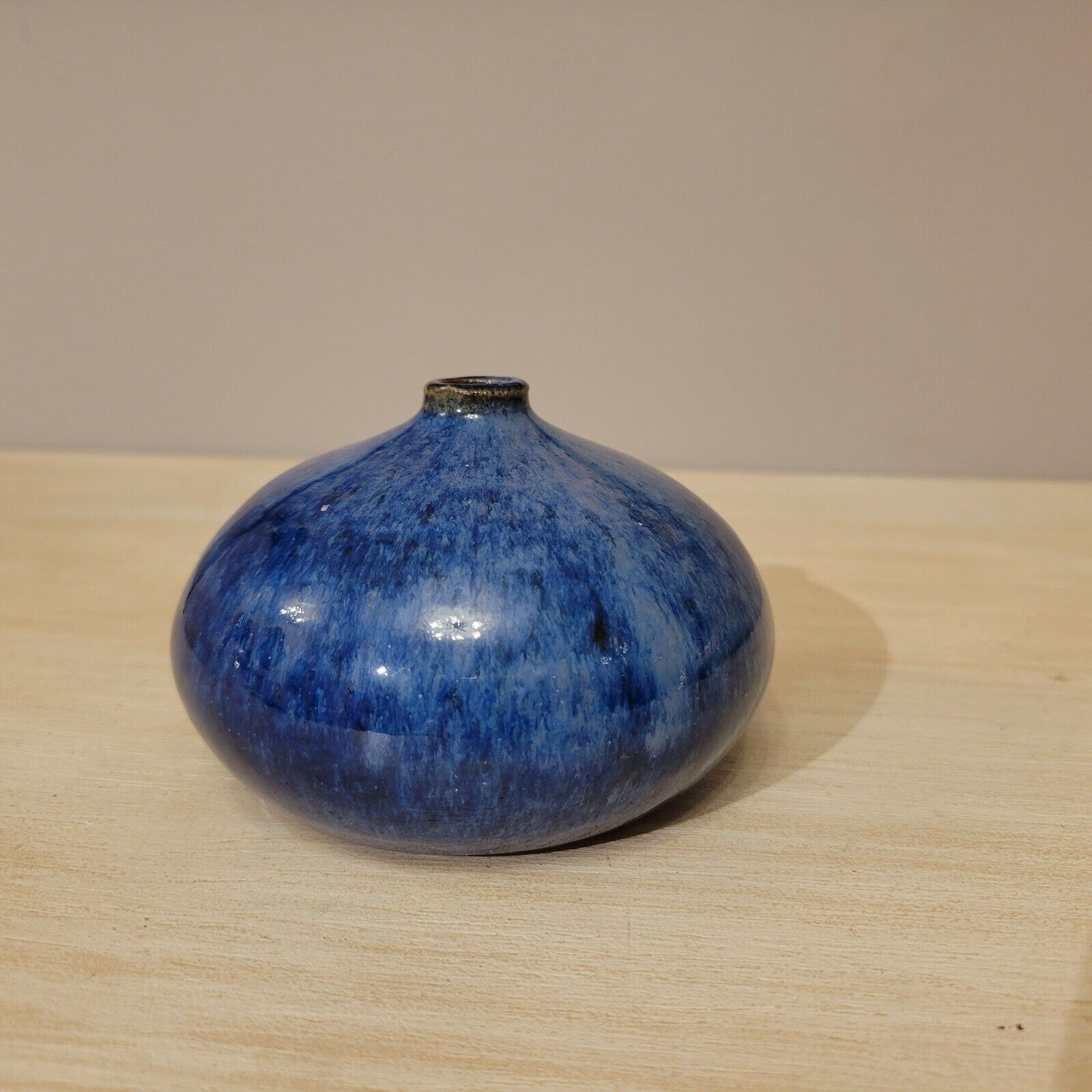 Small blue enamelled ceramic ball vase