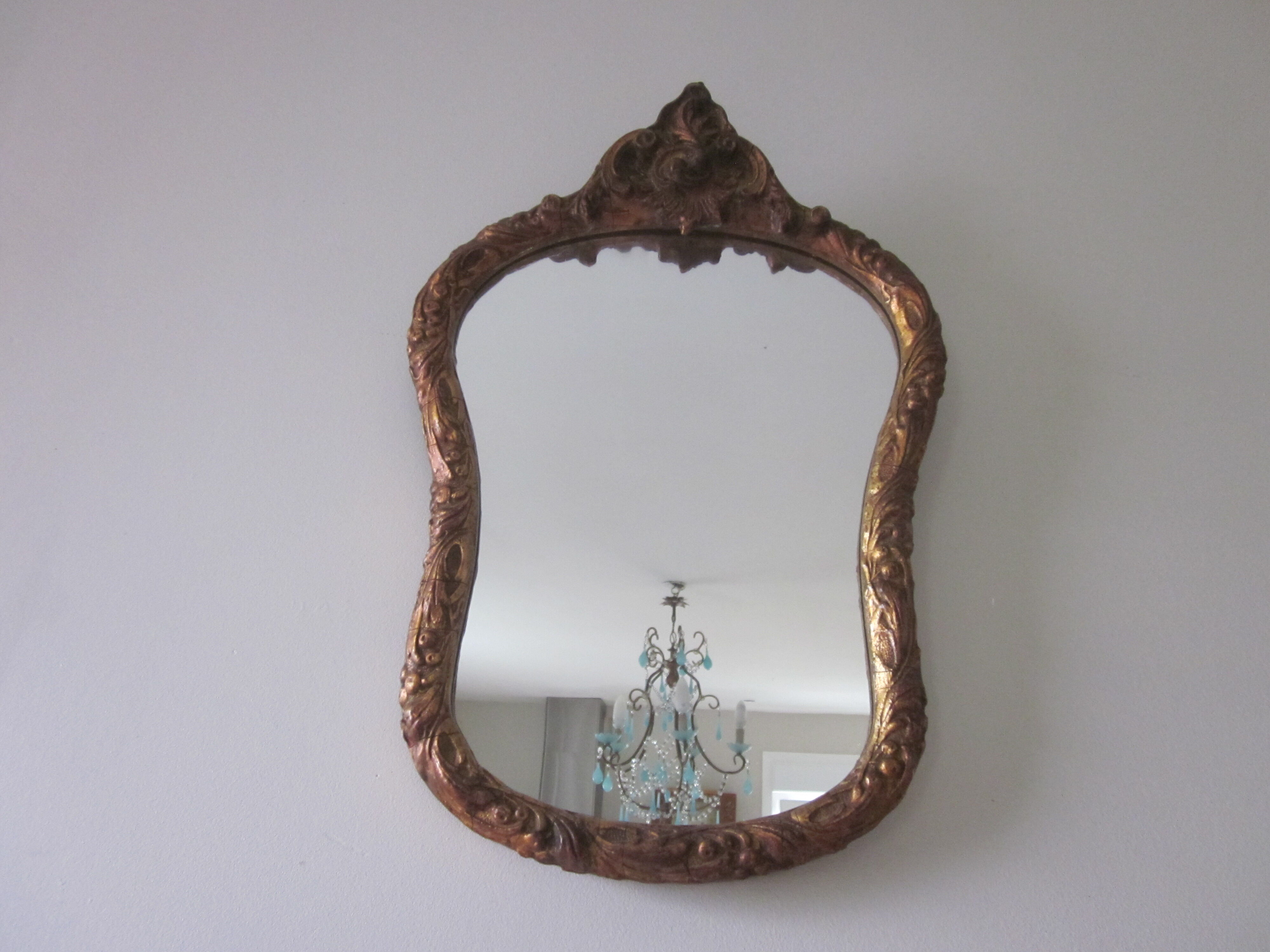 Old mirror in wood and stucco dorè