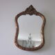 Old mirror in wood and stucco dorè