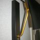 Pair of modernist sconces in black and gold metal