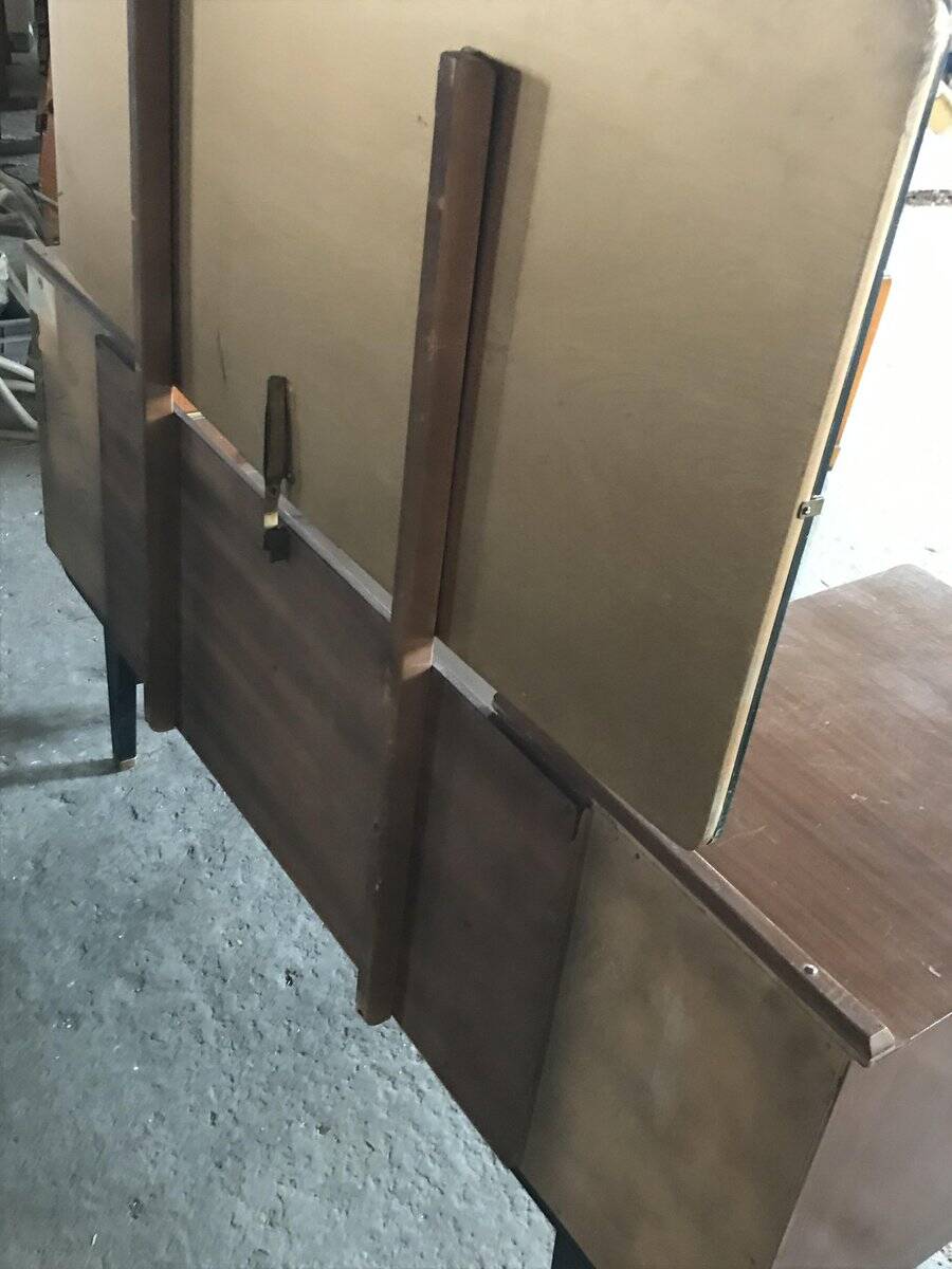 Mid-century hairdresser in brown teak and white with a mirror and brass legs.