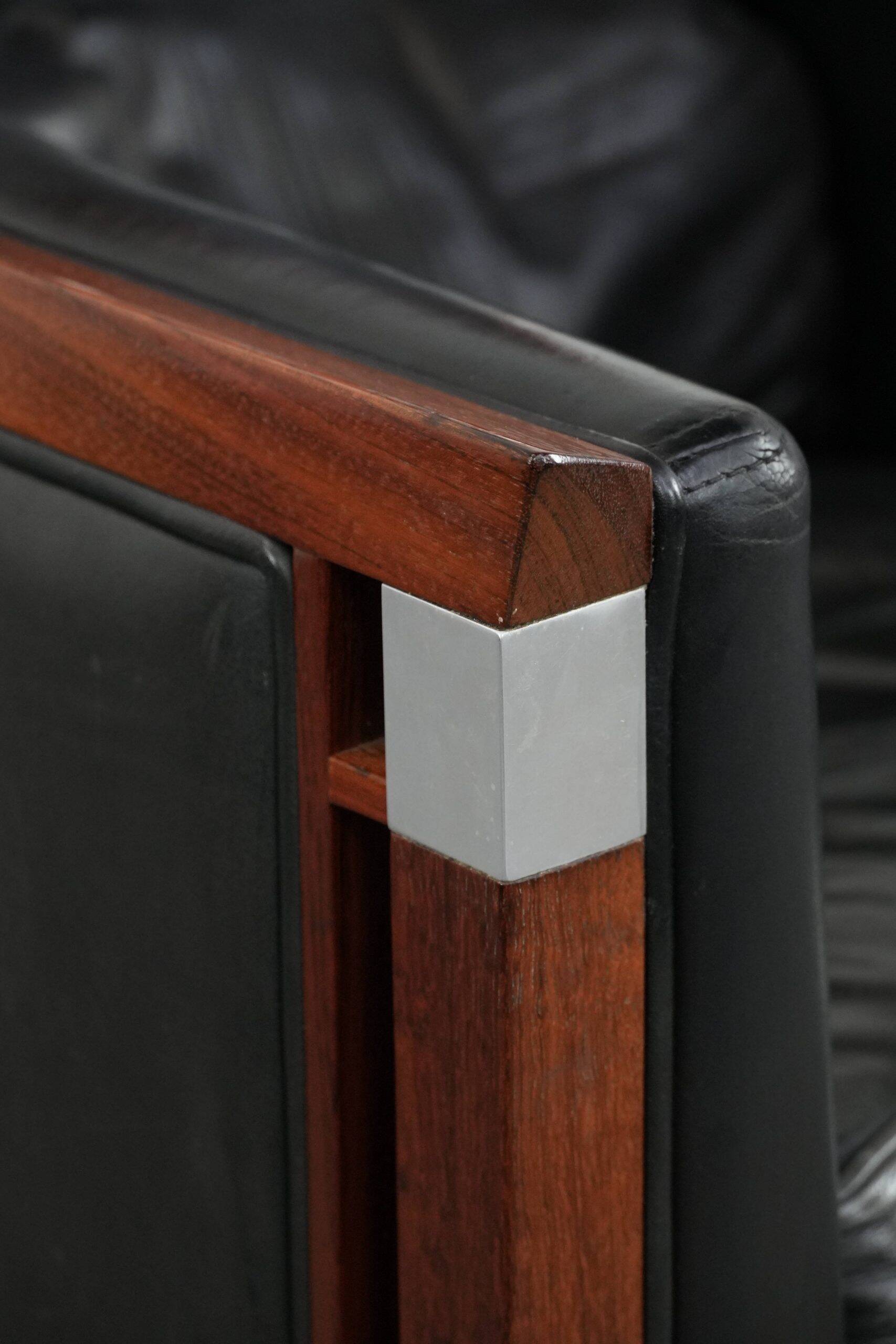 Black cowhide leather and wooden Art Deco design armchair