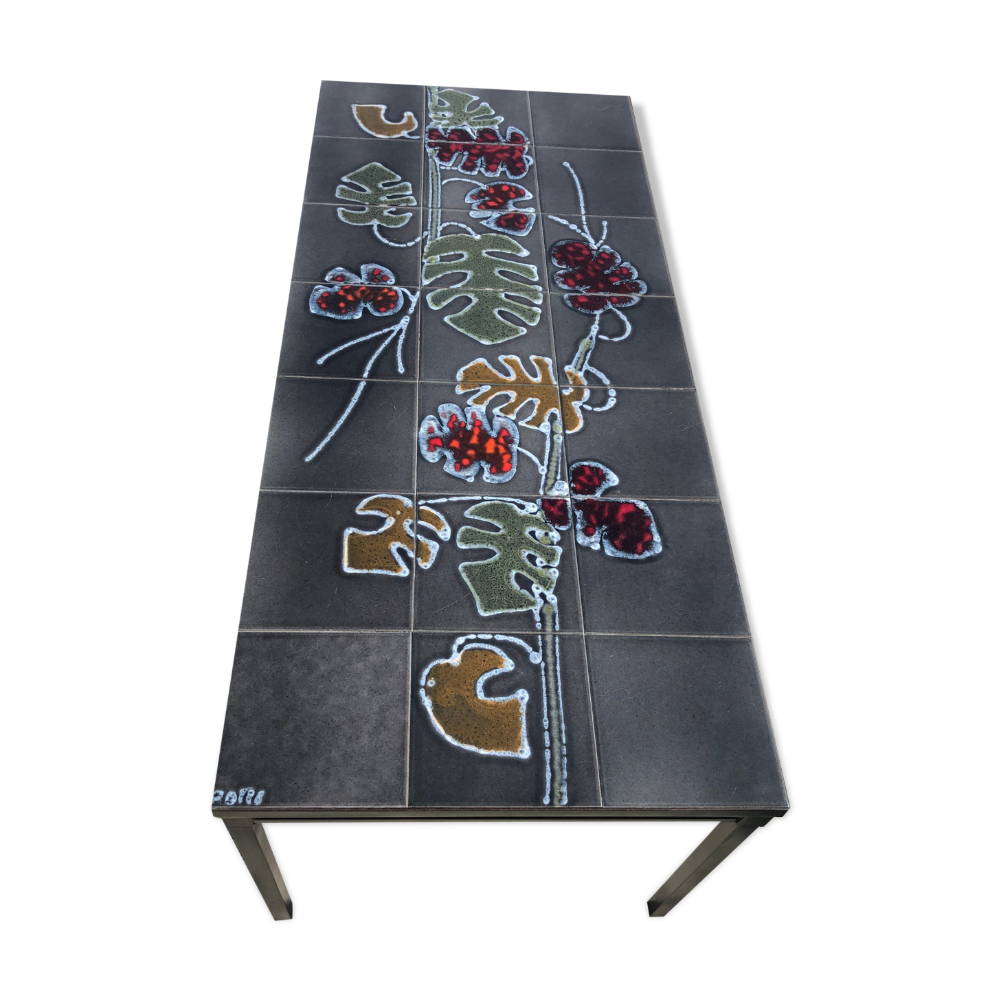 Enamelled ceramic table Philodendrons motifs, signed Adri