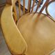 Wooden swivel armchair