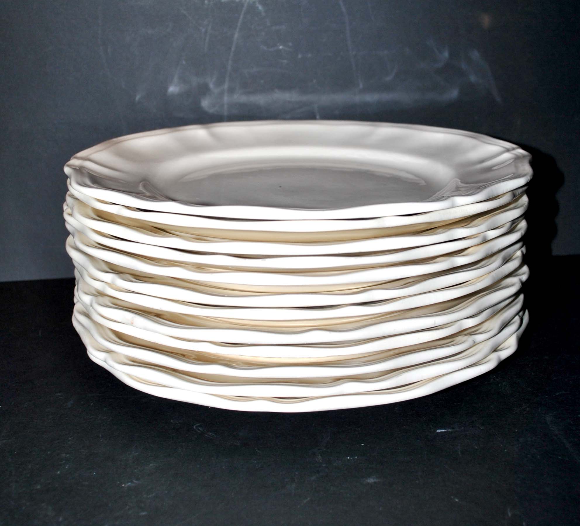 Sarreguemines series of 12 flat plates in opaque faience cream "terre de fer"