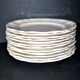Sarreguemines series of 12 flat plates in opaque faience cream "terre de fer"