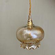 Suspension globe vintage en verre ambré
