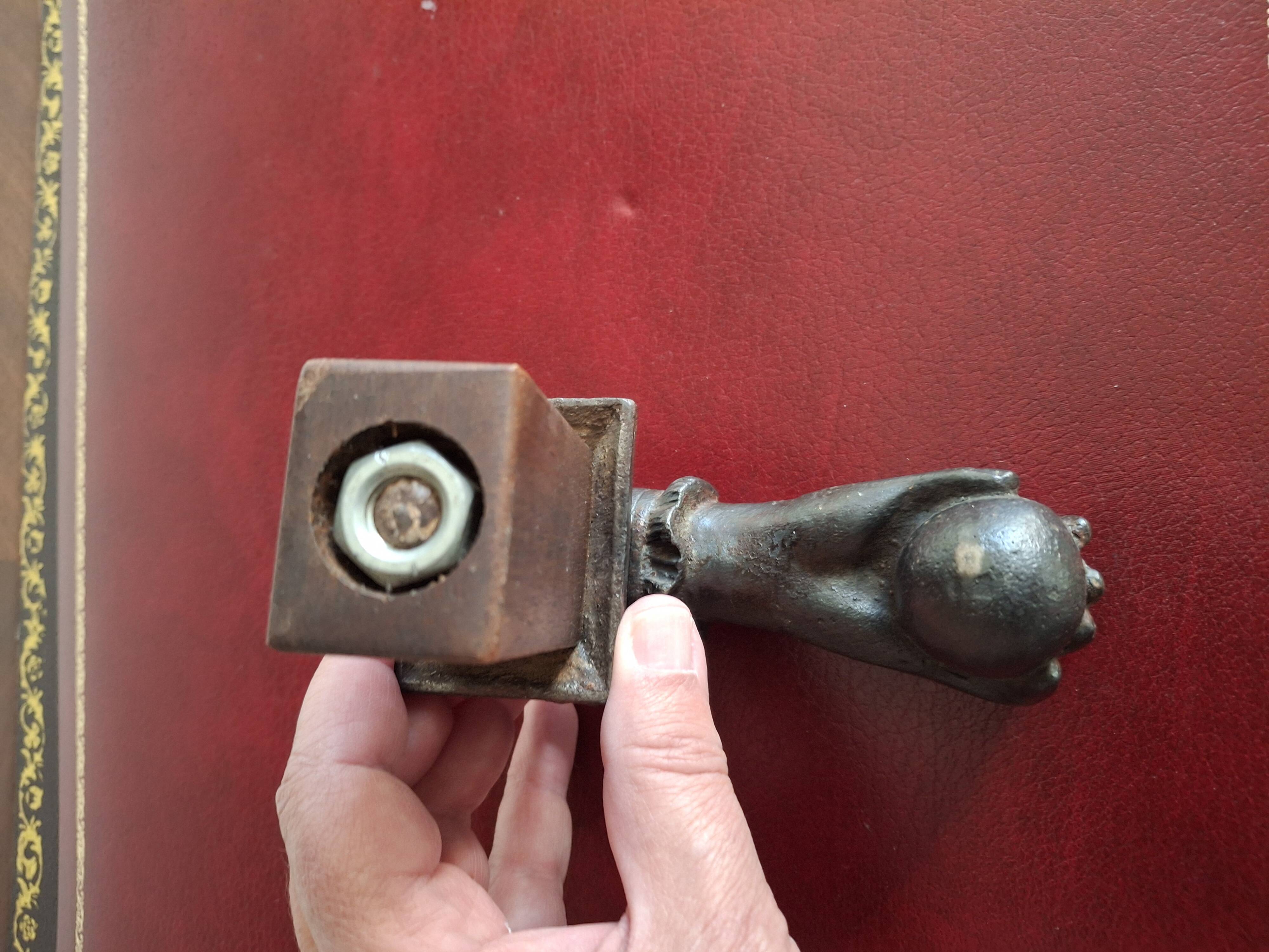 Cast iron door knocker from the 19th century or earlier.