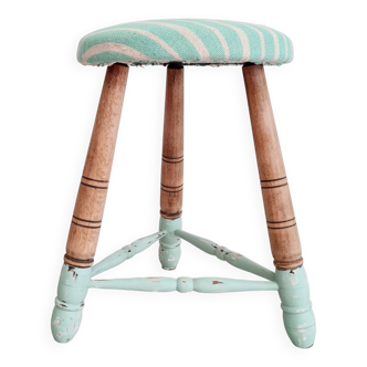 Weathered green and striped tripod stool