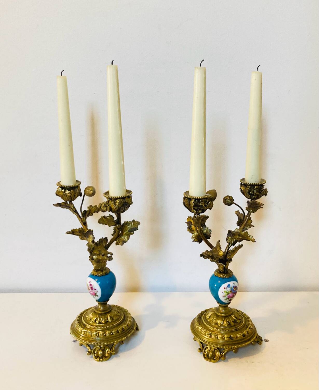 19th century candle holders in gilded bronze and porcelain