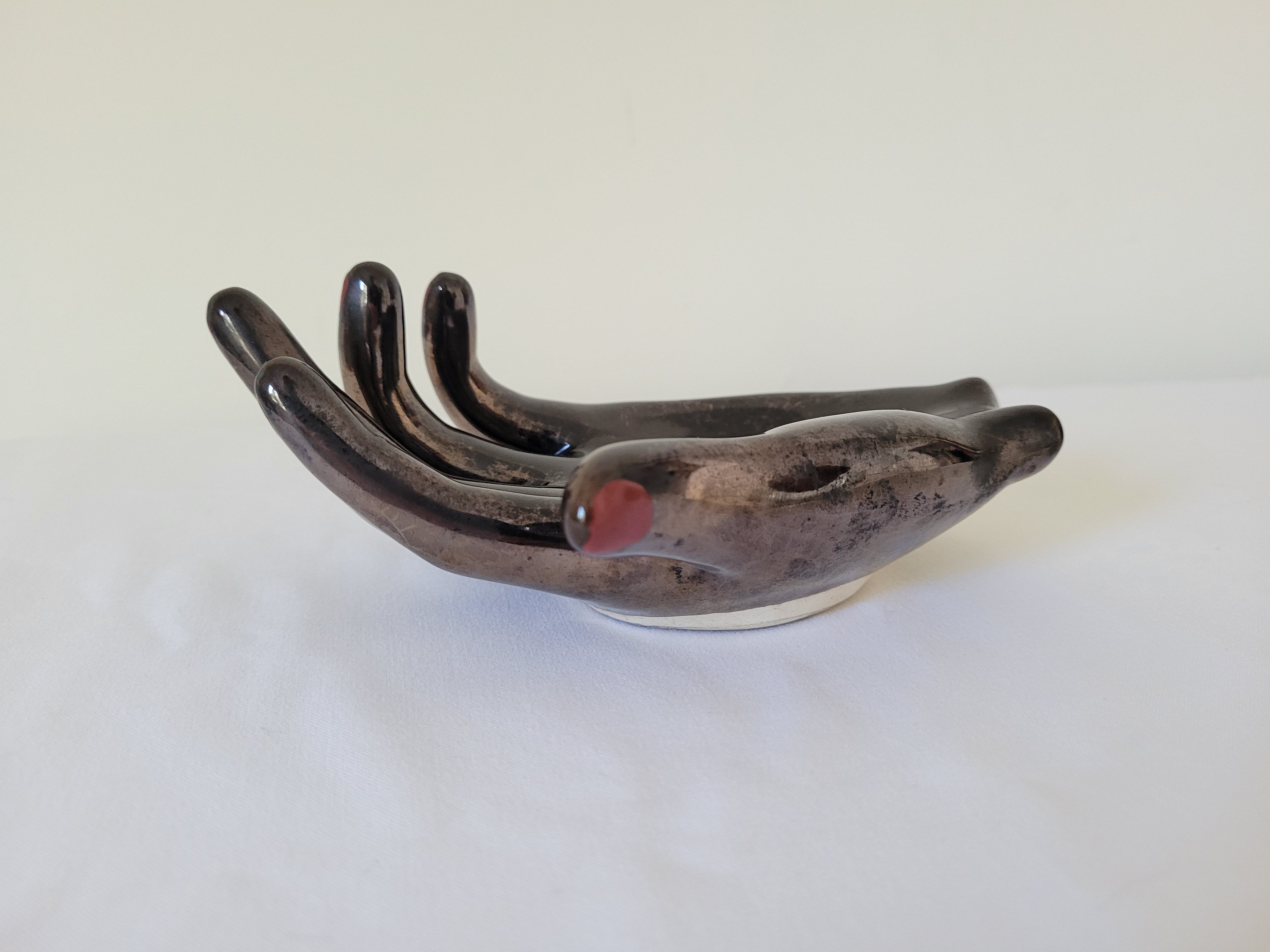 Empty pockets in the shape of a hand