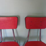 Table in red formica, 4 roc chairs, 2 extension cords, 2 drawers 60