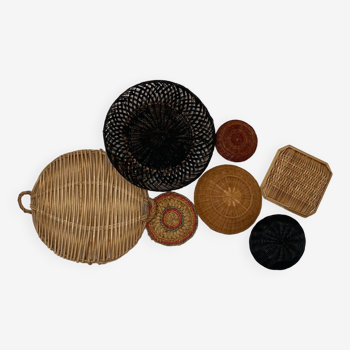 Wall composition of wicker baskets and trays.