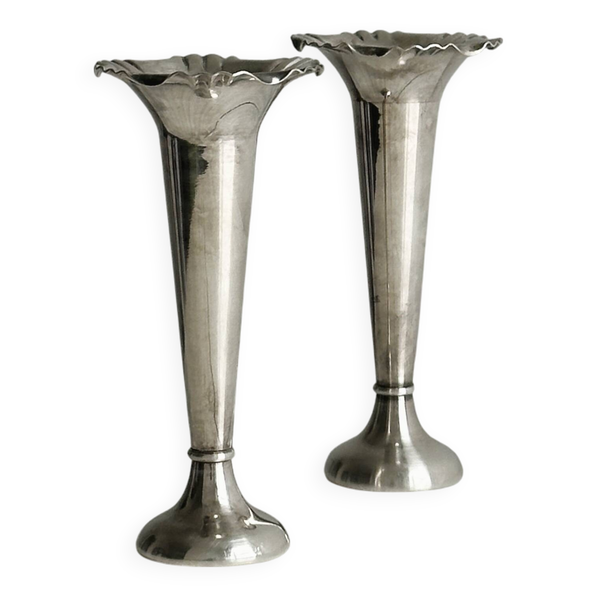 Pair of shiny silver metal vases