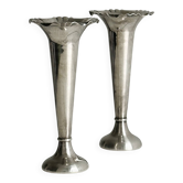 Pair of shiny silver metal vases