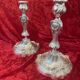 Pair of candlesticks, torches in silver bronze