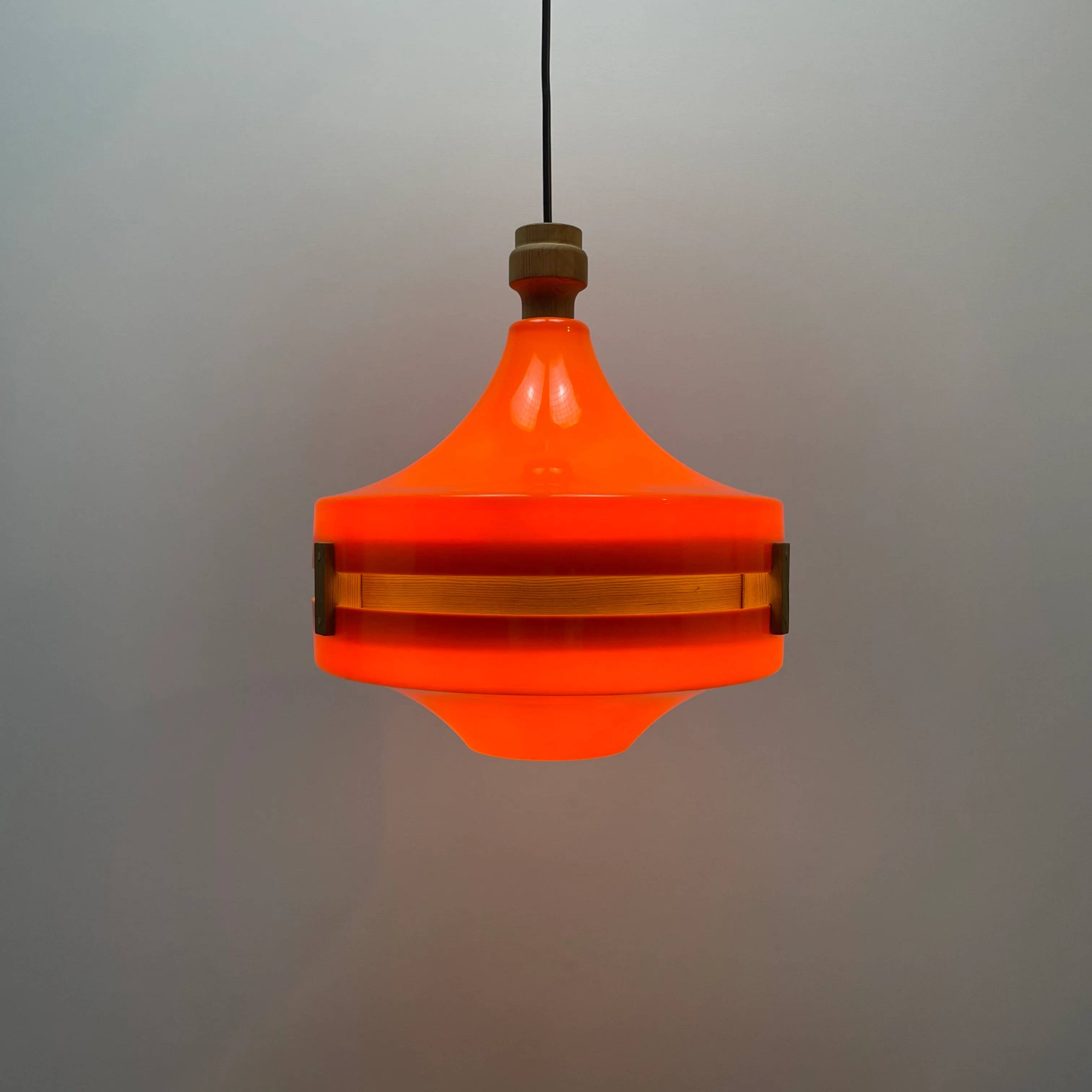 1970s orange Scandinavian suspension light in plexiglass shaped like a UFO.
