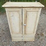 Solid beige wood cabinet with door drawers