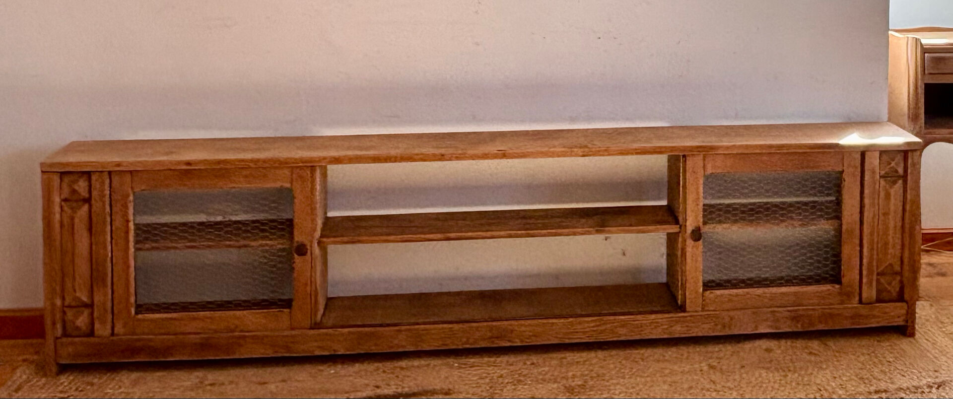 Vintage oak sideboard TV unit with sliding doors.