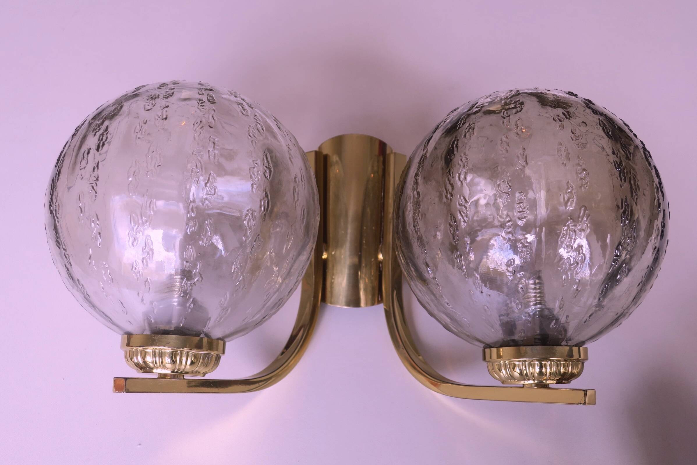 Mid century pair of brass and glass double wall lights, 1970s
