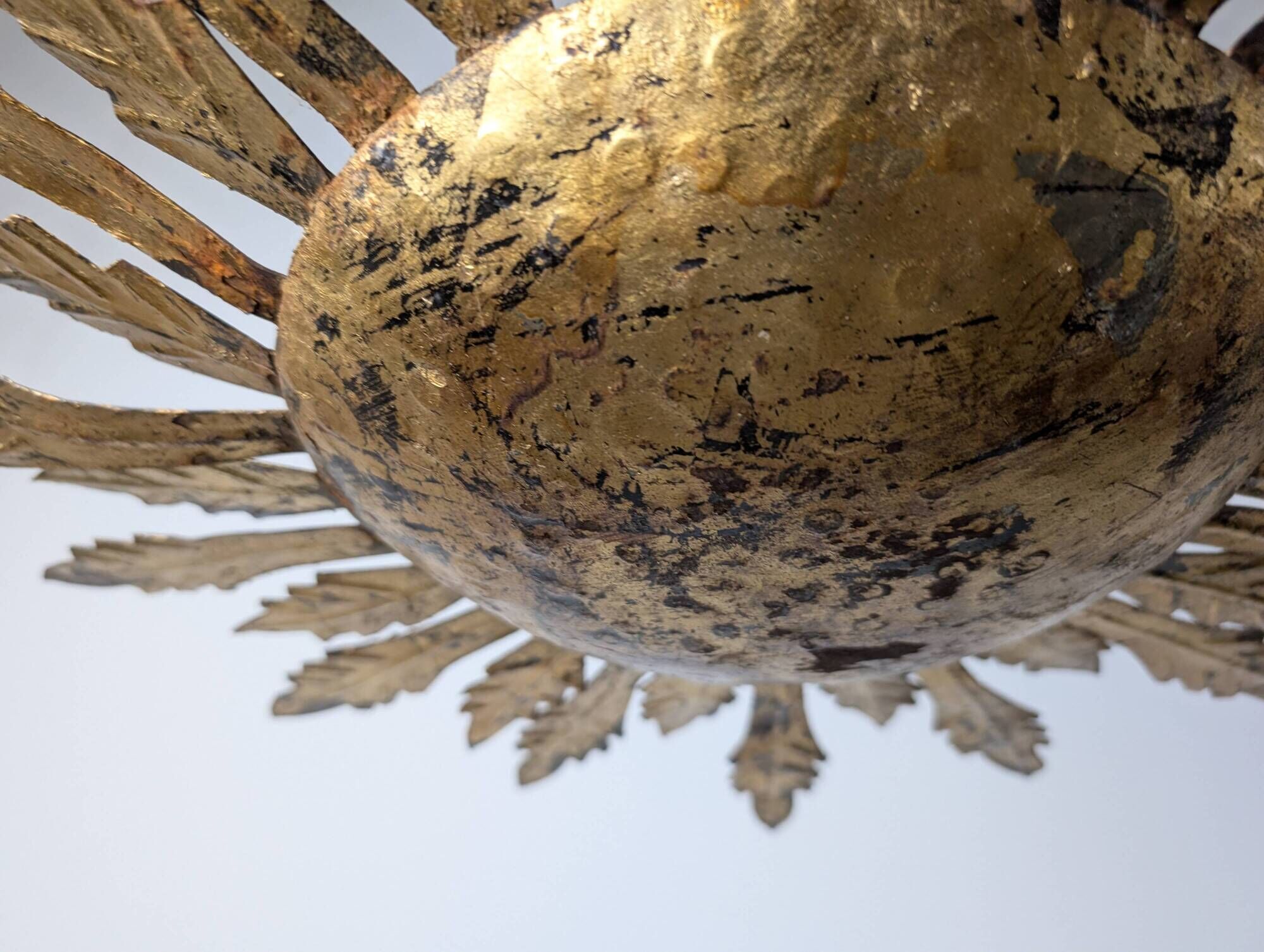 Mid-century sun ceiling lamp in gilded metal with leaf rays, 1950s