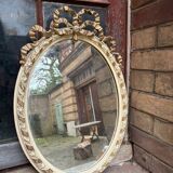 Small old oval gilded mirror