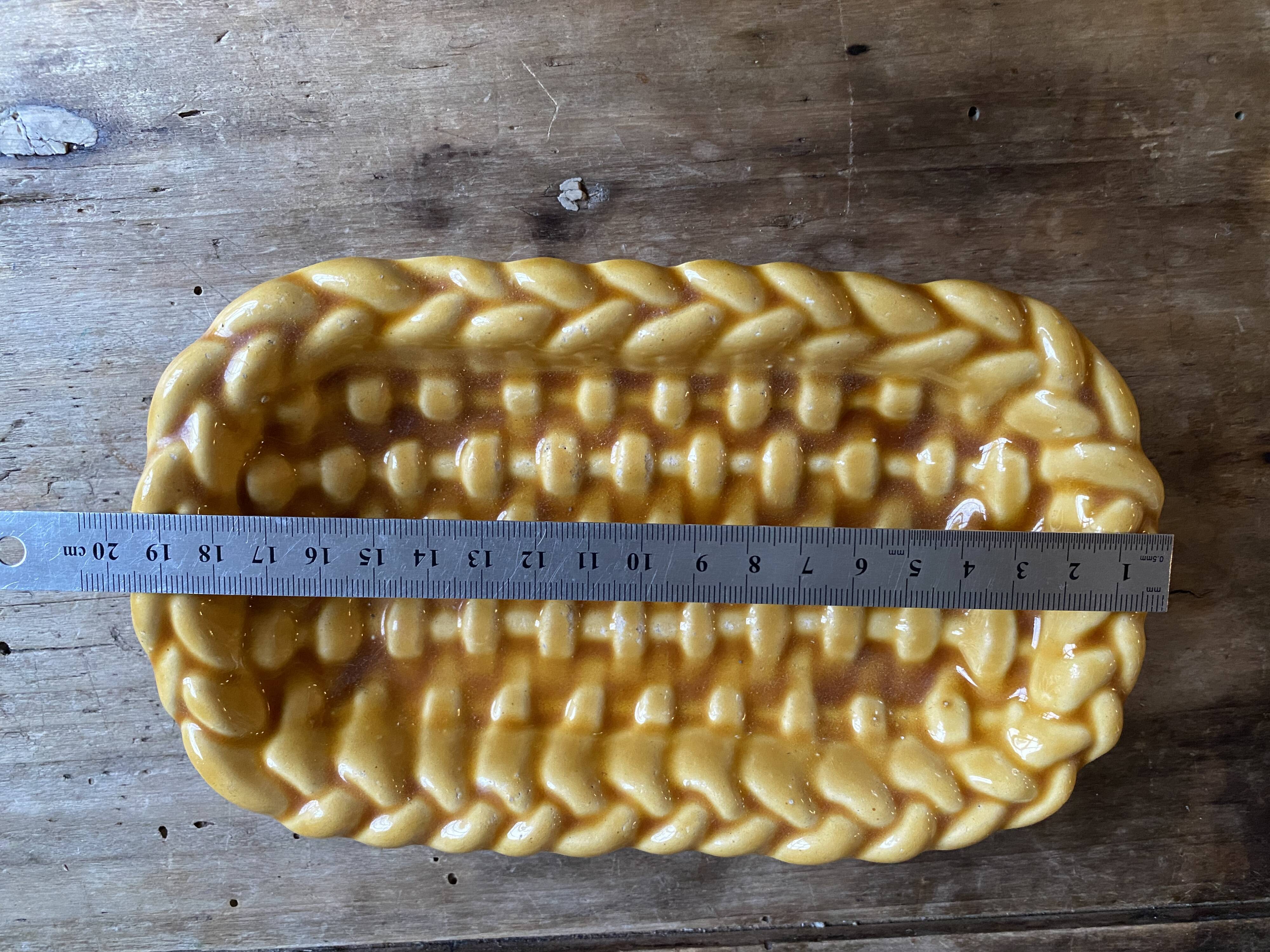 Mustard braided slip pocket emptier