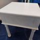 Coffee or night table in white painted wood with colonnade legs and one drawer