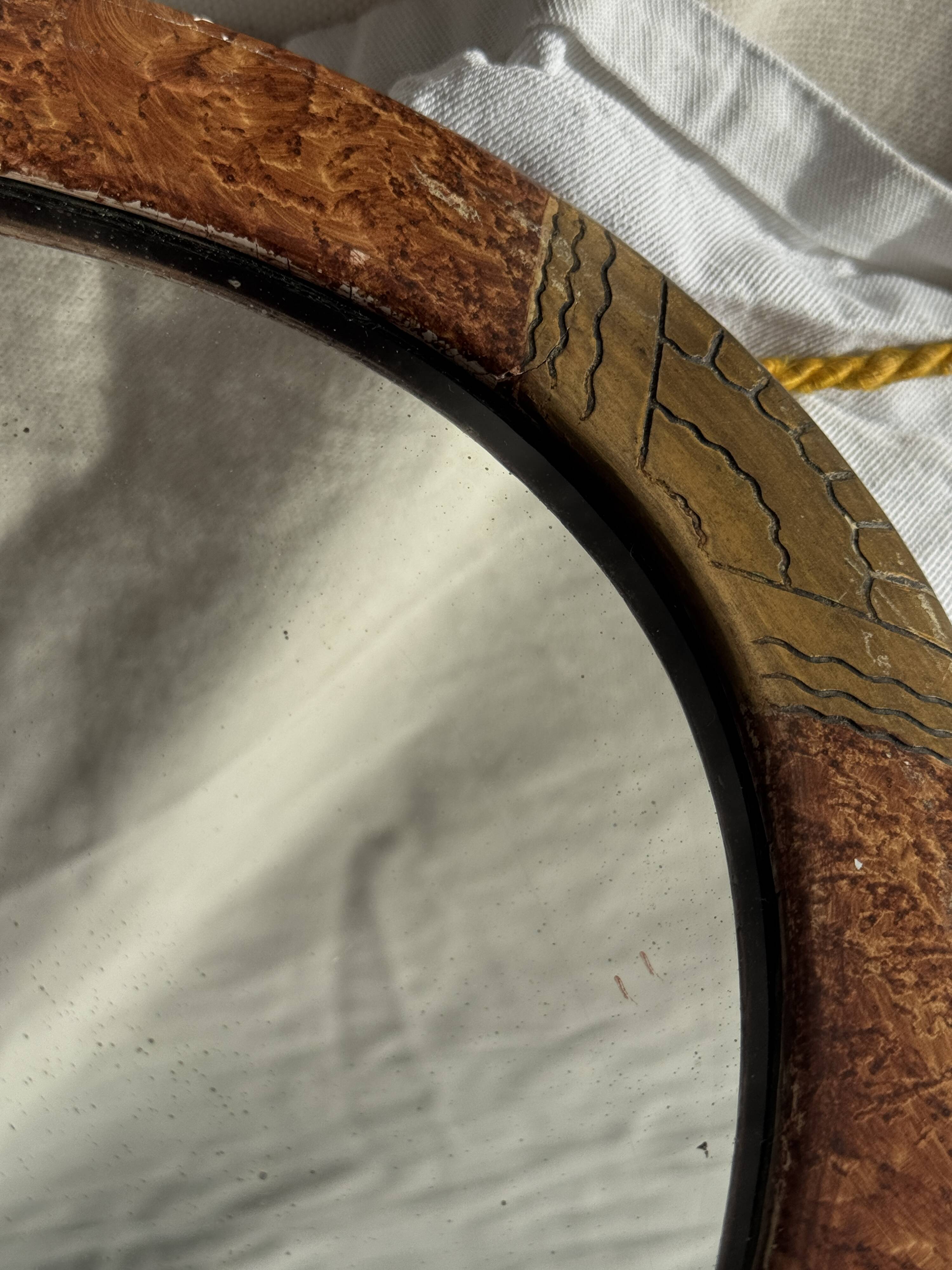 Small oval Art Deco mirror in brown and gold 33x54.