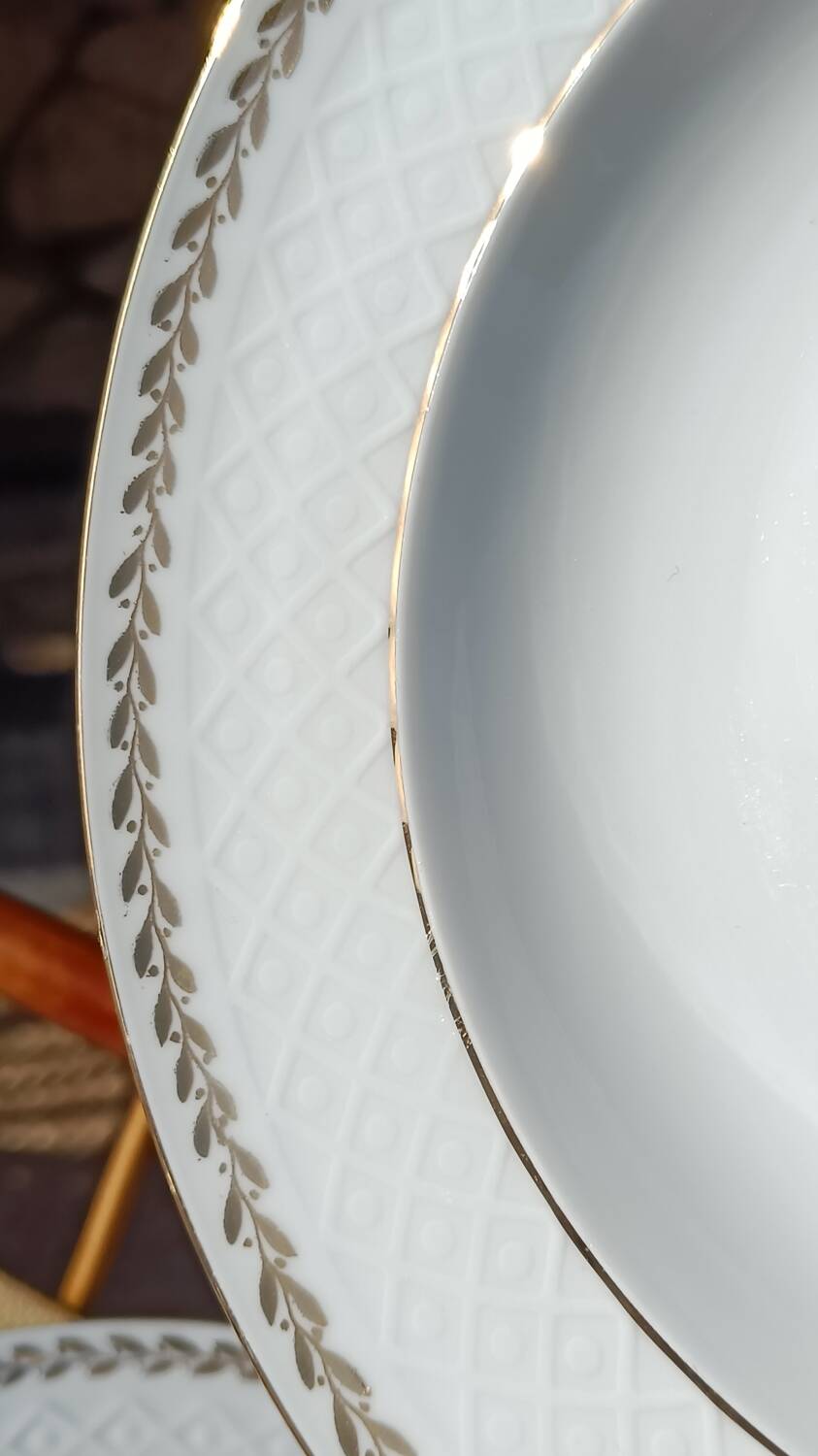 Twelve white porcelain plates