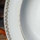Twelve white porcelain plates