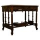 19th-century carved walnut desk with a leather top.