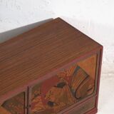 Small Japanese cabinet with sliding doors, Kabuki decoration, made of paulownia wood, early Showa period, circa 1926–1970.