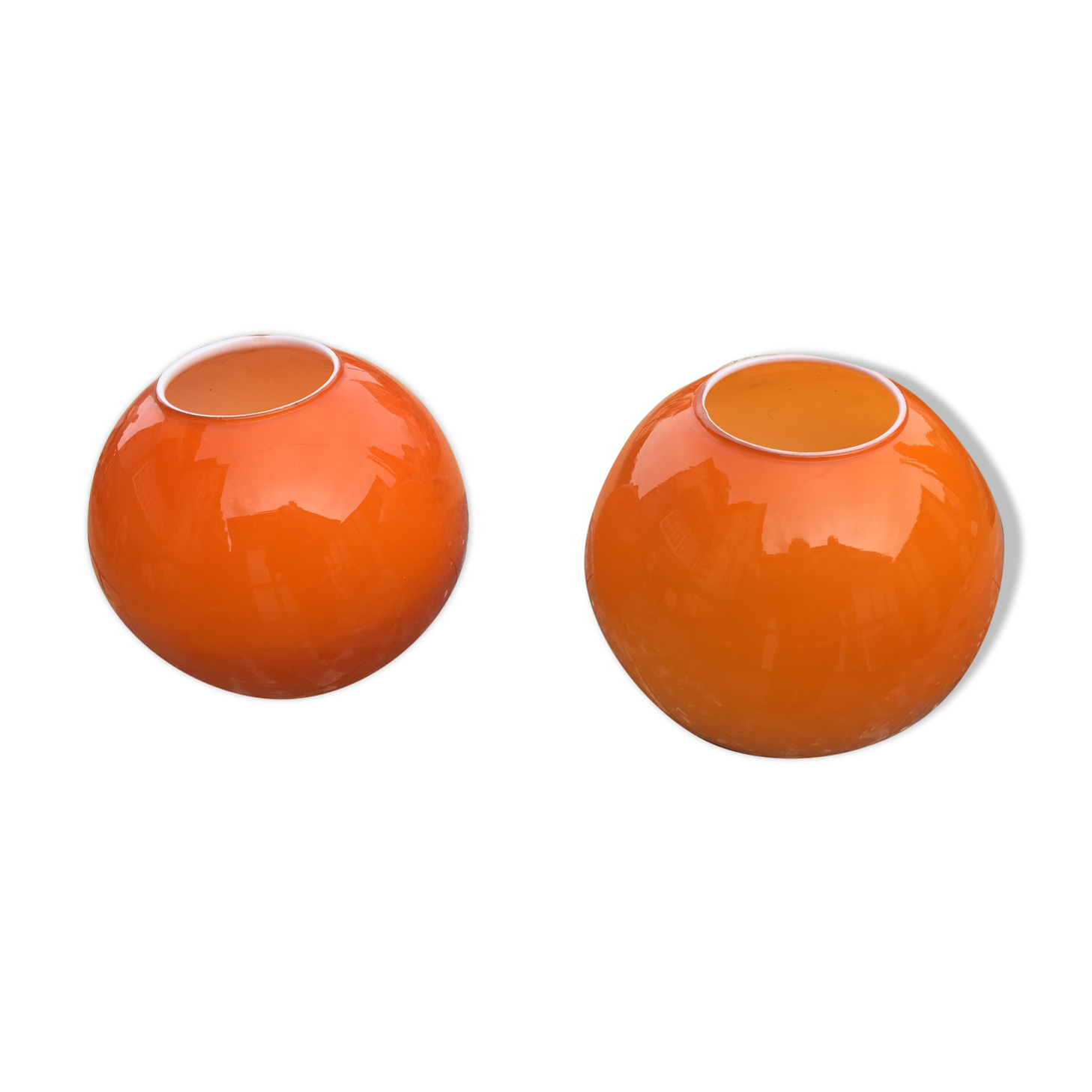 Two orange opaline globes, 30 cm diameter
