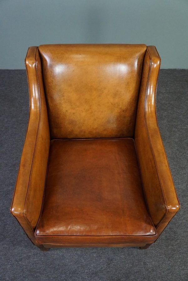 Modern charming armchair in sheepskin