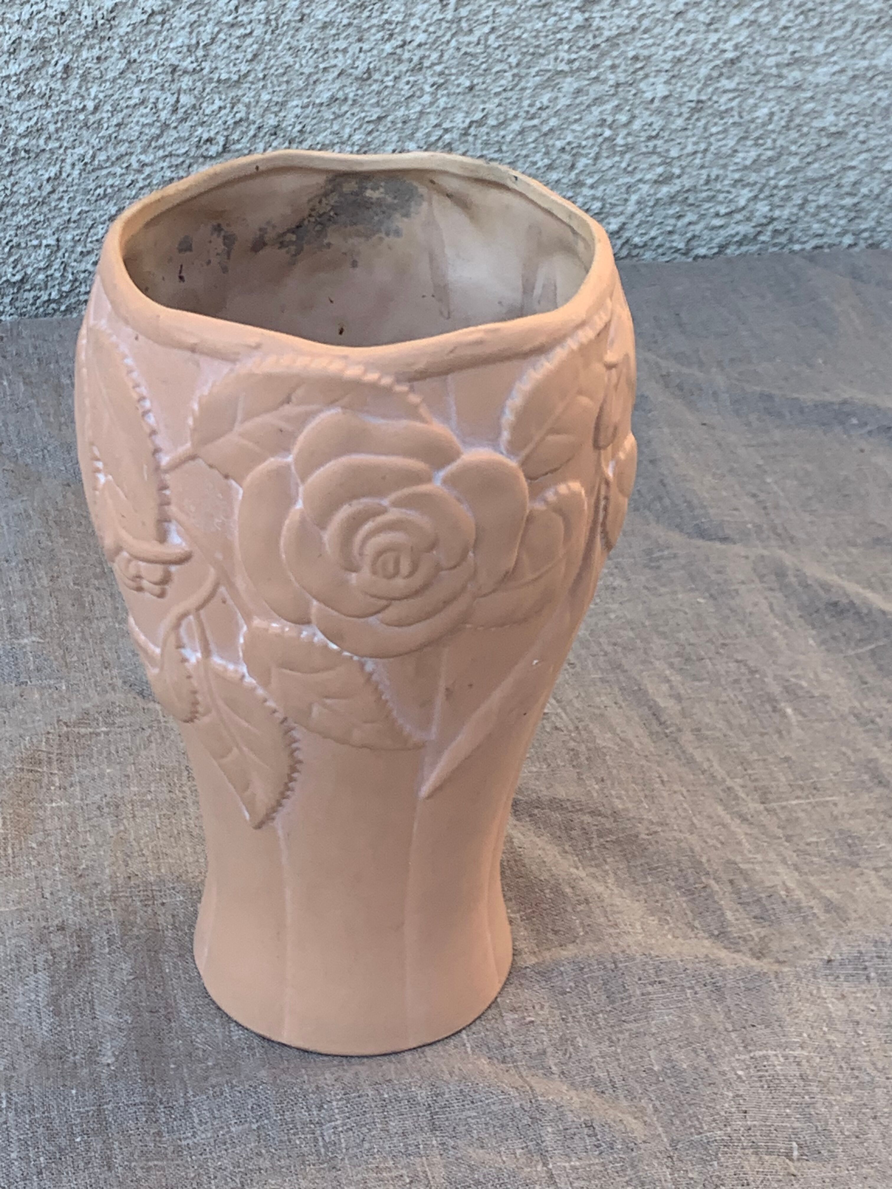 Terracotta vase with a vintage ceramic relief rose pattern