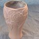 Terracotta vase with a vintage ceramic relief rose pattern