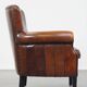 Sheepskin armchair/lounge chair finished with decorative nailheads