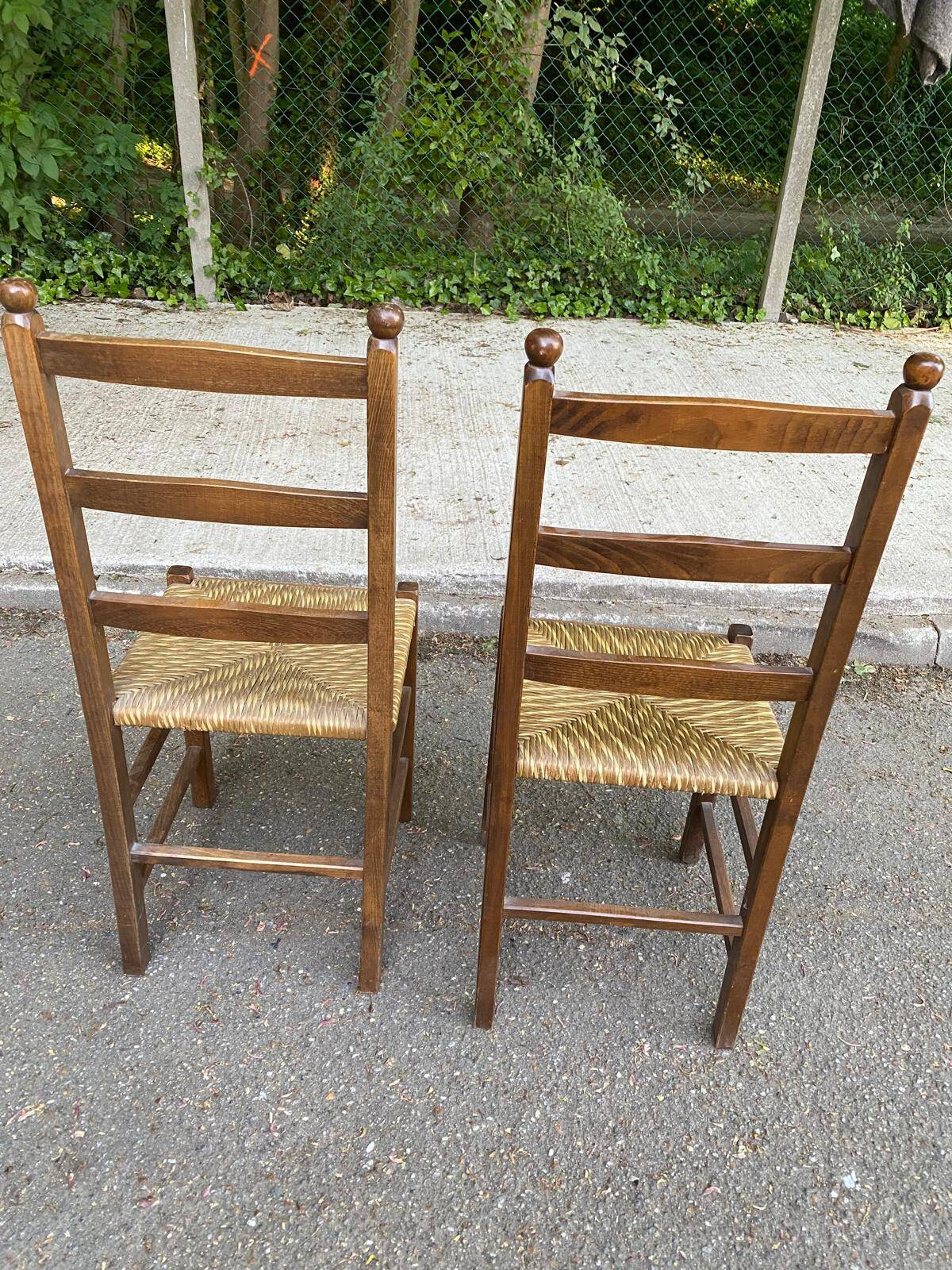 2 solid wood and straw chairs
