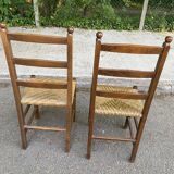 2 solid wood and straw chairs